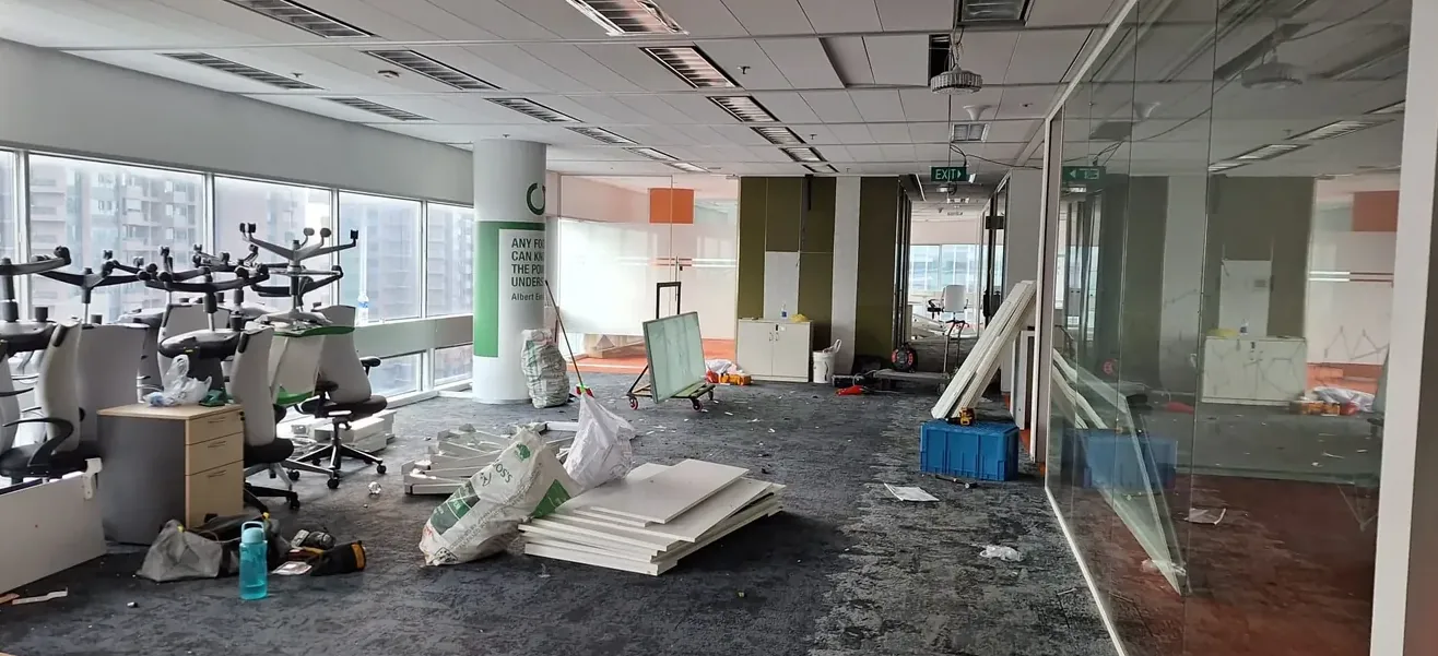 Office reinstatement project: partitions and fit-out being stripped out across an open floor
